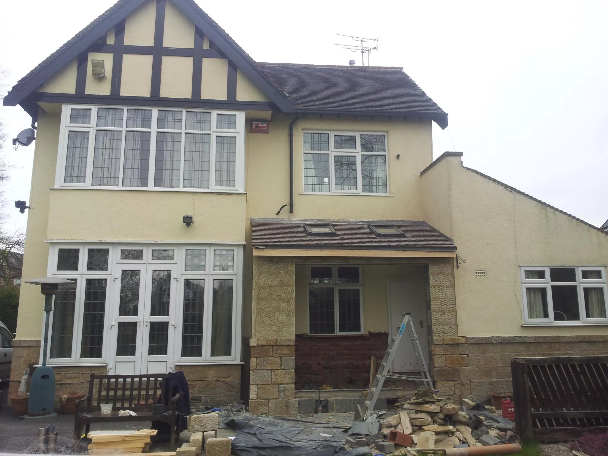 a house with a lot of windows in front of it