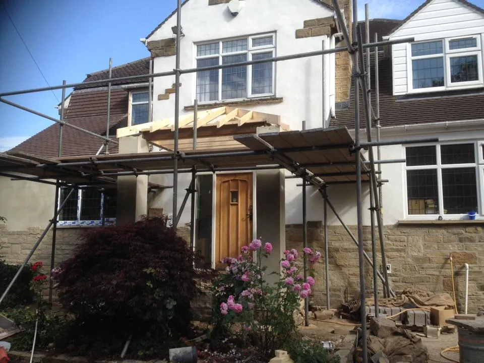 a house under construction with scaffolding around it